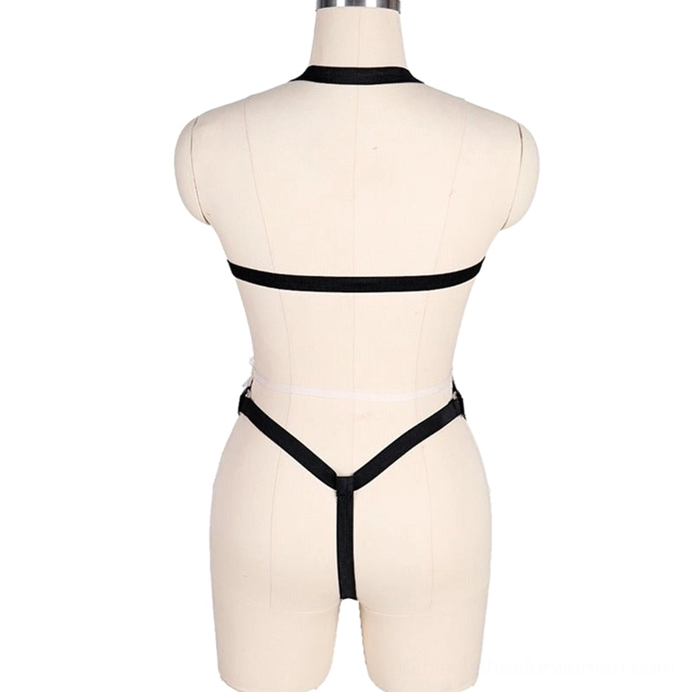 Back view of patent leather bodysuit harness showing elastic back straps and Y-shaped lower harness band structure