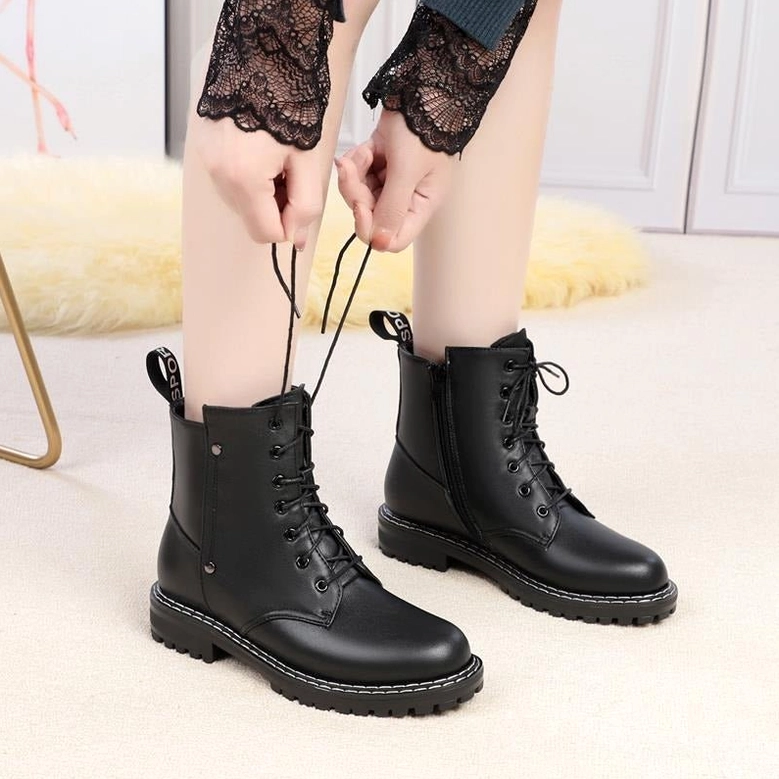 Combat ankle boot side zipper closure detail - functional gothic utility design element
