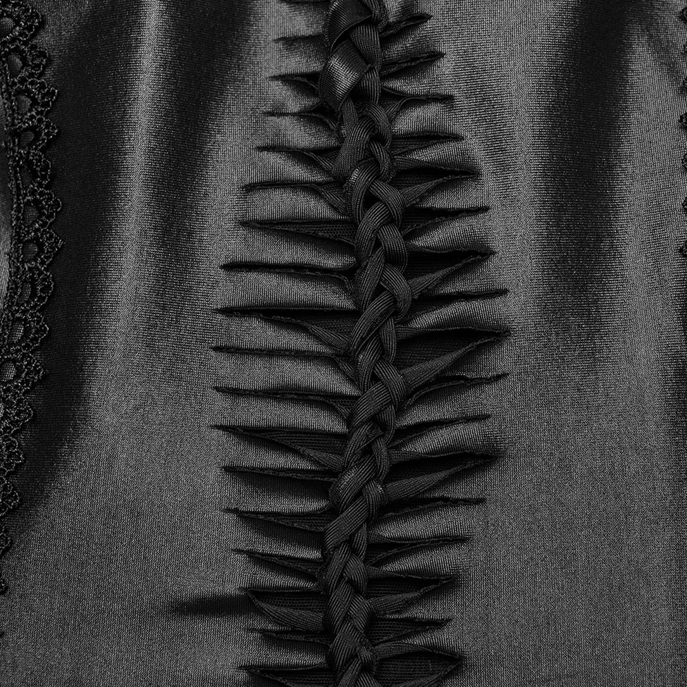 Detailed close-up of braided ribbon lace-up design and delicate lace trim edge on gothic maxi dress