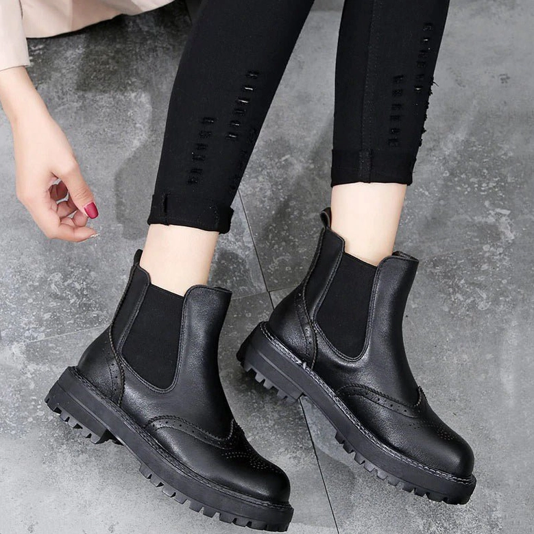 Brogue-detailed Victorian-inspired Chelsea ankle boots with structured platform sole