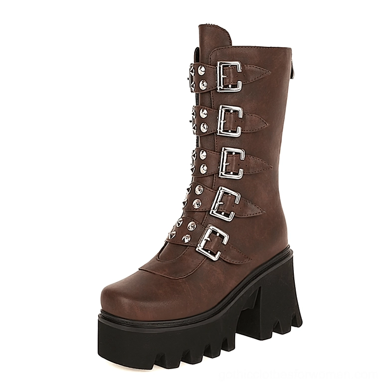 Brown cognac platform combat boots with silver buckle straps and chunky black platform sole side angle