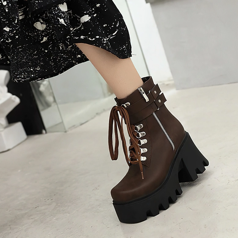 Deep brown gothic platform boots with ankle strap buckle and side zipper, styled with black print dress for alternative fashion aesthetic