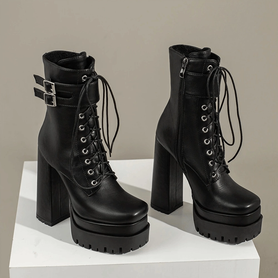 Brown gothic platform ankle boots studio shot showing rich leather and elevated platform design