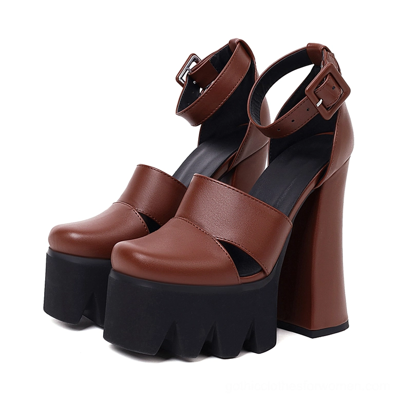 Brown gothic platform ankle strap high heels with black serrated platform, displaying architectural heel design