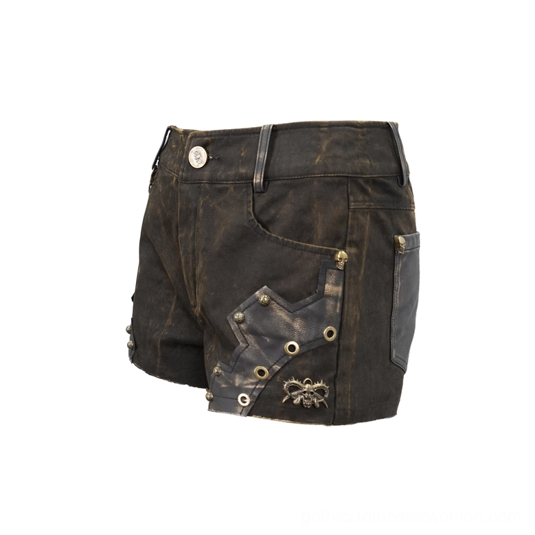 Brown gothic shorts angled flat lay - scorpion metal charm, rivet and eyelet patch decorations