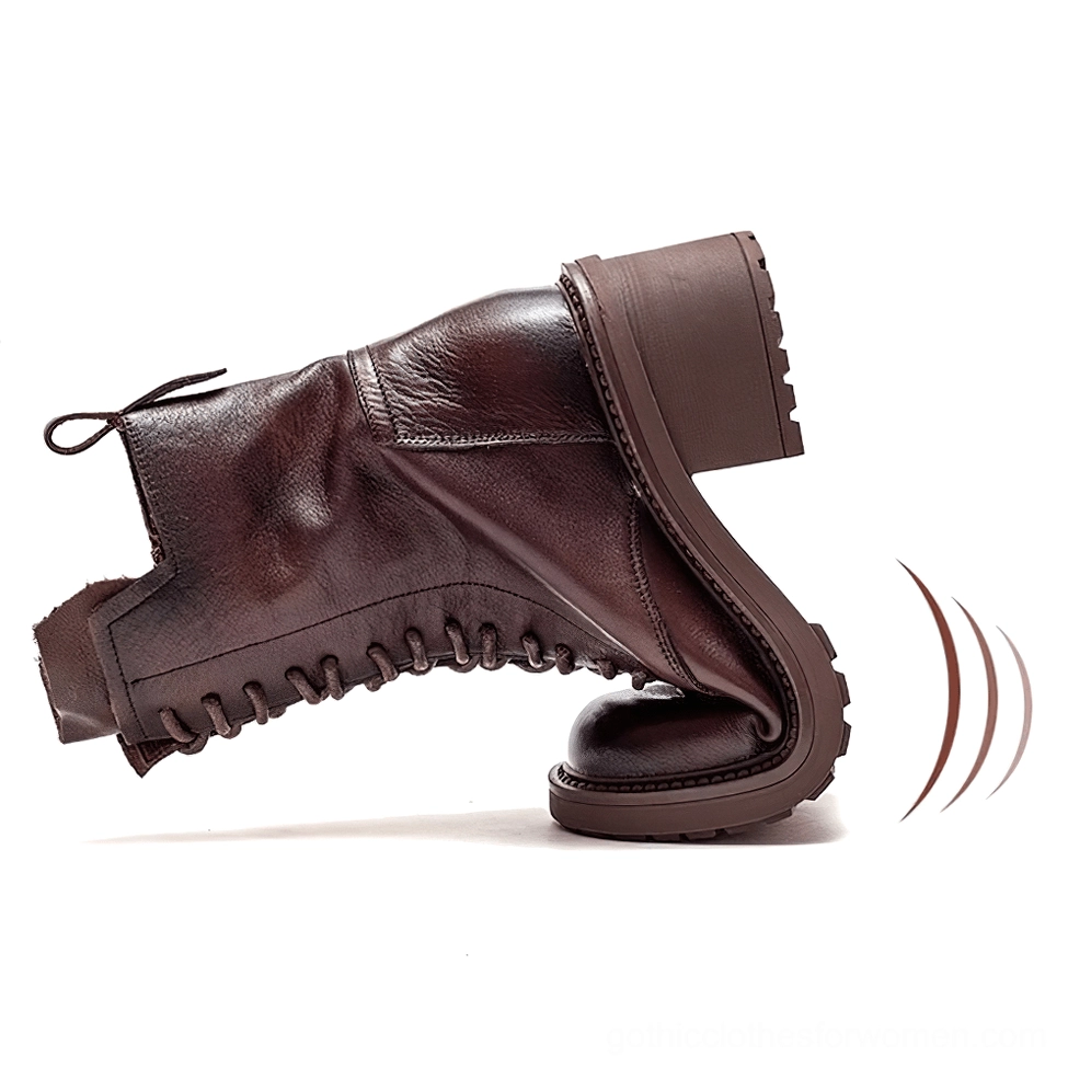 Brown leather gothic ankle boot showing flexible soft leather material in bending position