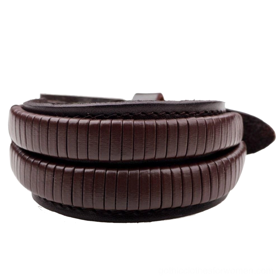Brown wide genuine leather gothic cuff bracelet flat lay top view displaying ribbed texture and antique metal hardware