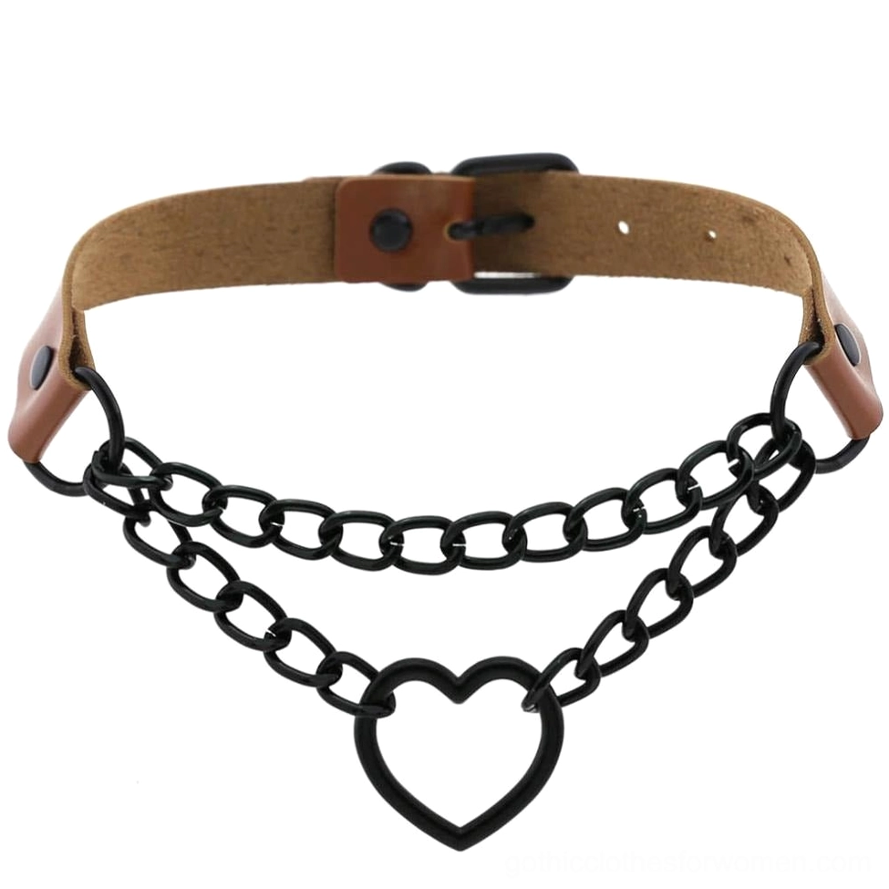 Brown leather heart choker flat lay showing gothic chain and hollow heart pendant with adjustable closure