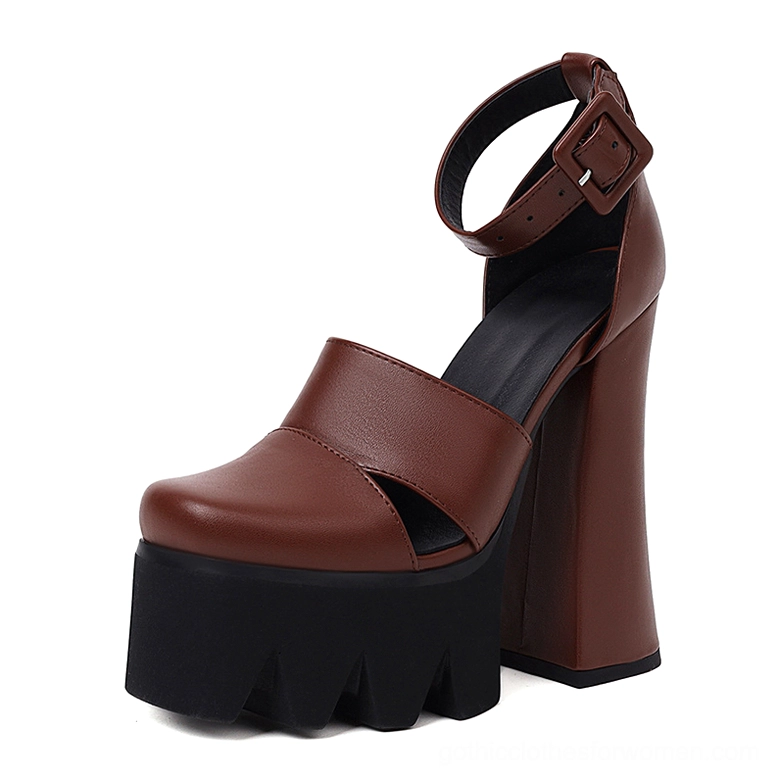 Single brown gothic platform sandal, right side view showing adjustable ankle buckle strap and covered toe cap