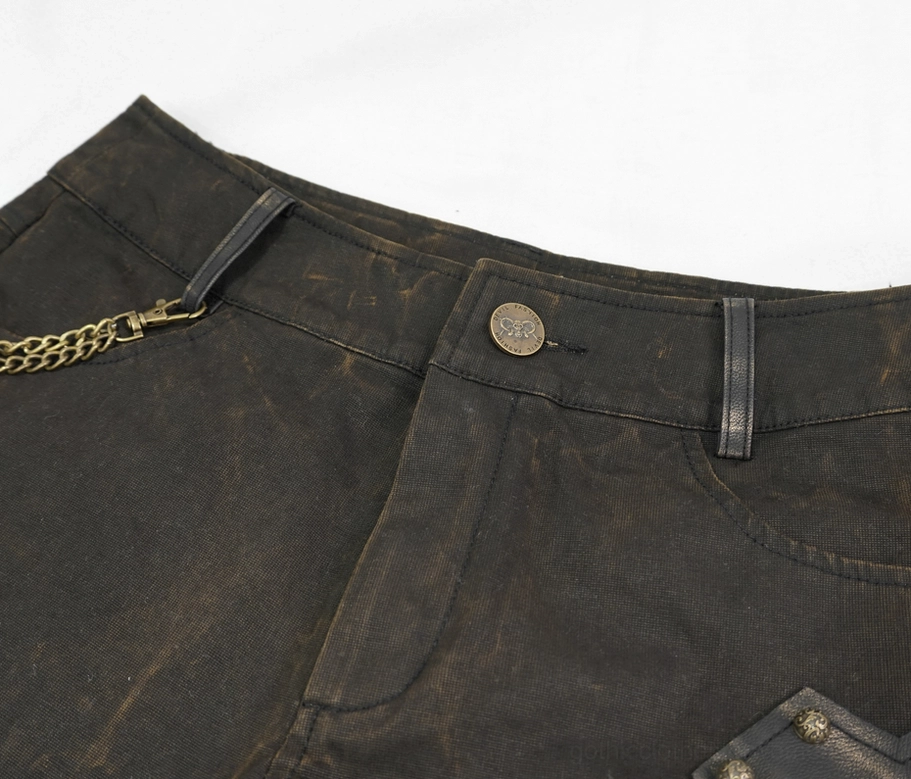 Brown studded leather shorts texture detail - distressed waxed leather with bronze rivet hardware