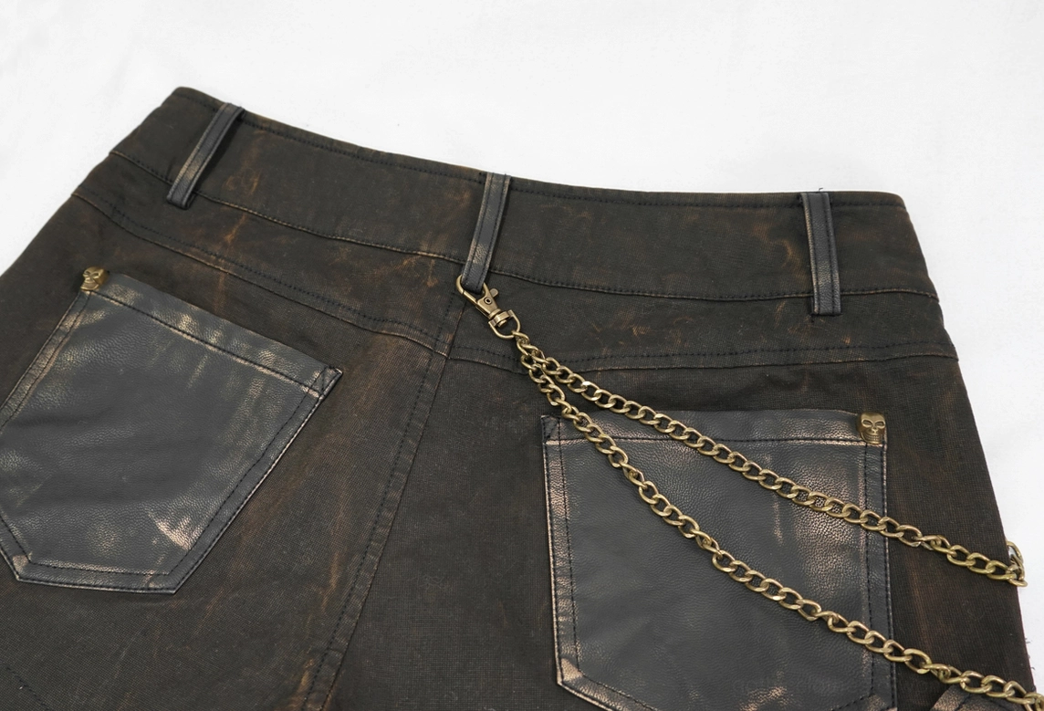 Brown studded shorts back close-up - double waist chain and stitched pocket seams detail