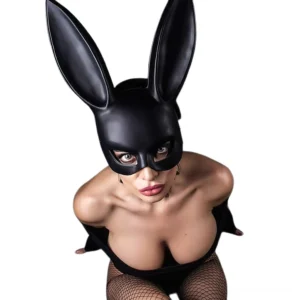 Black bunny cosplay mask close-up detail shot showing matte finish and sculptural rabbit ears on tattooed model
