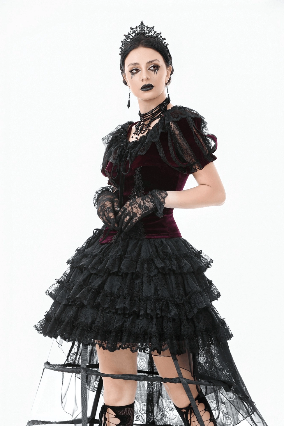 Front detailed view of burgundy bolero showing black lace appliqué and mesh ruffle accents