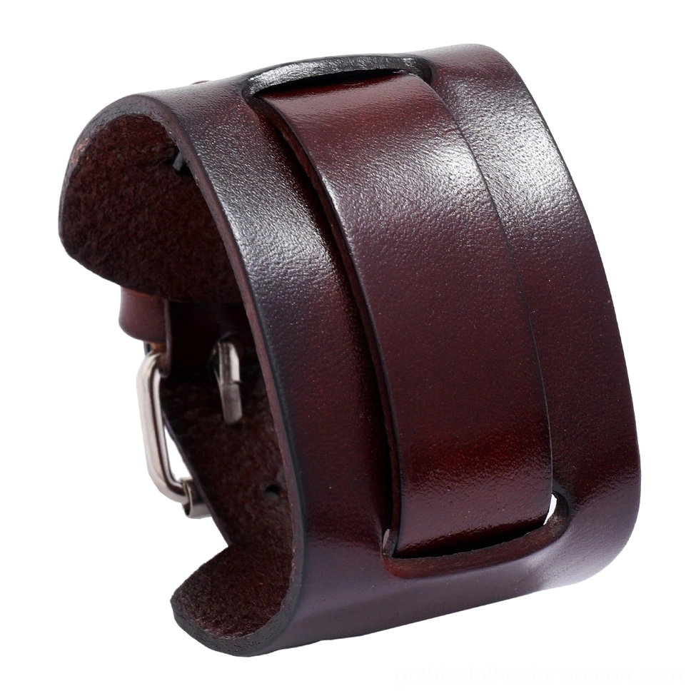 Burgundy brown cowhide leather wide cuff bracelet with textured surface and metal closure, 3/4 side view