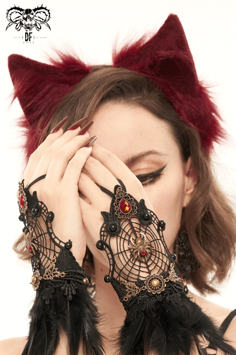 Close-up frontal view of burgundy faux fur cat ears with hands, detailed texture shot