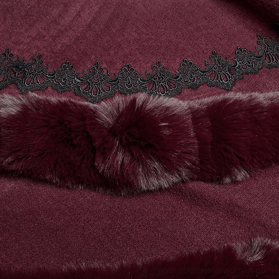 Detail shot of burgundy cloak lace and faux fur embellishment showing embossed black lace and plush pom-pom