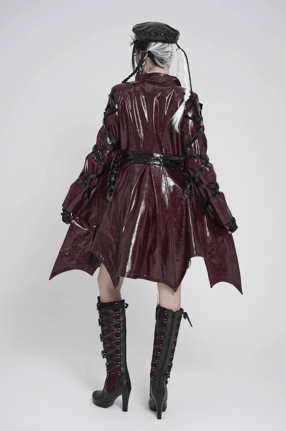Burgundy gothic faux leather coat styled detail view showing D-ring hardware and wrapped sleeve strap embellishments