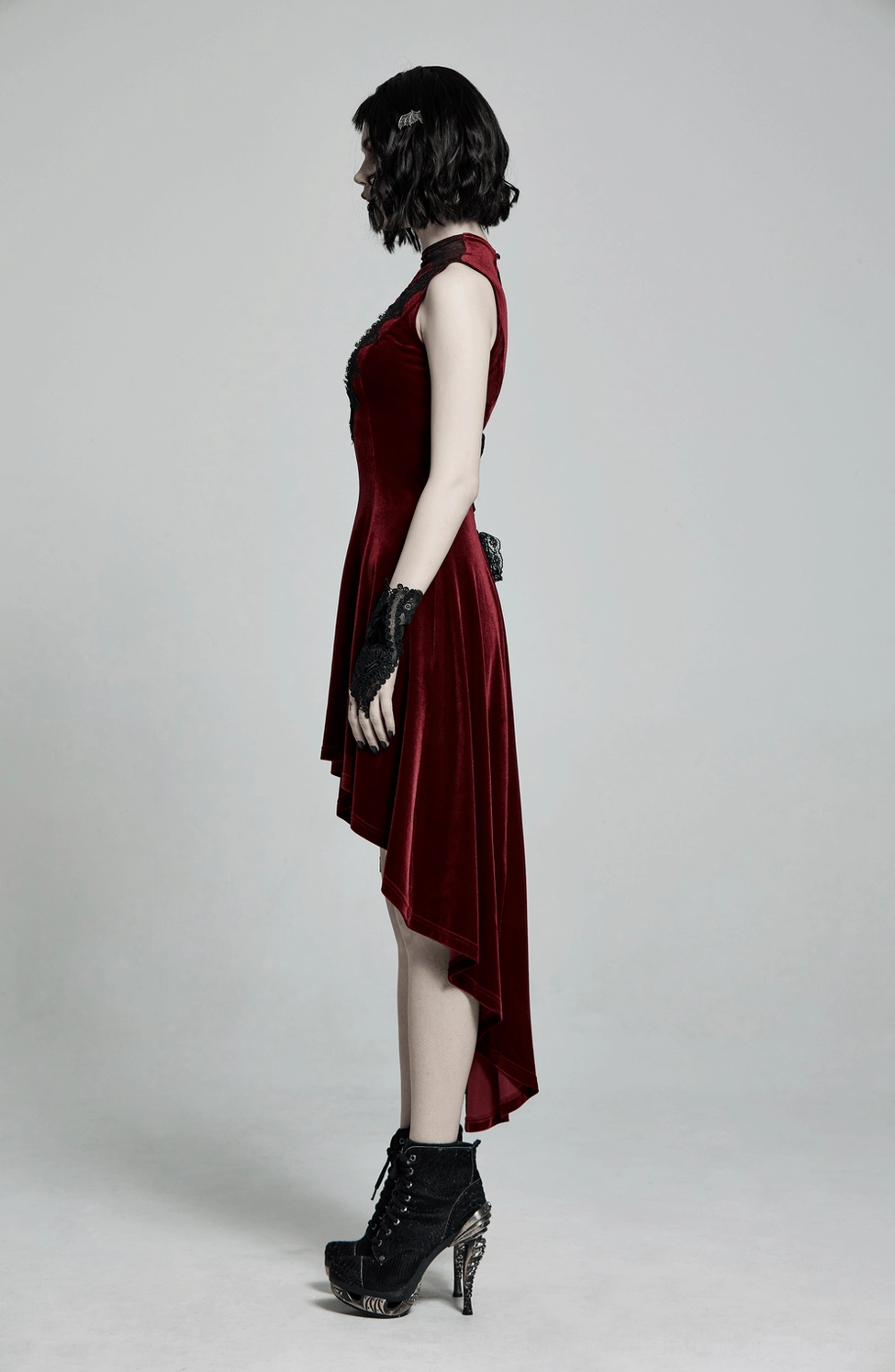 Burgundy velvet gothic dress styled detail showing form-fitting silhouette and ornate lace yoke design