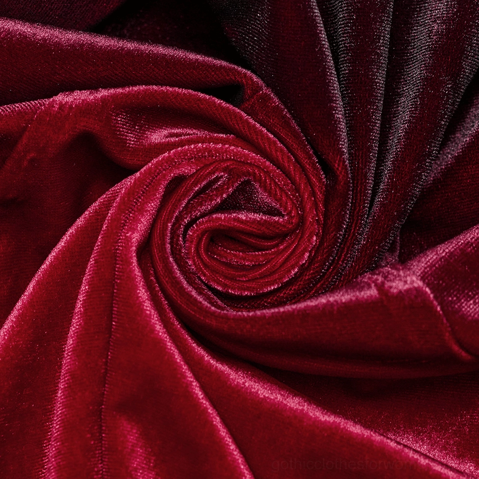 Full length burgundy gothic velvet dress on model displaying A-line silhouette, flared sleeves, and heart lace collar design