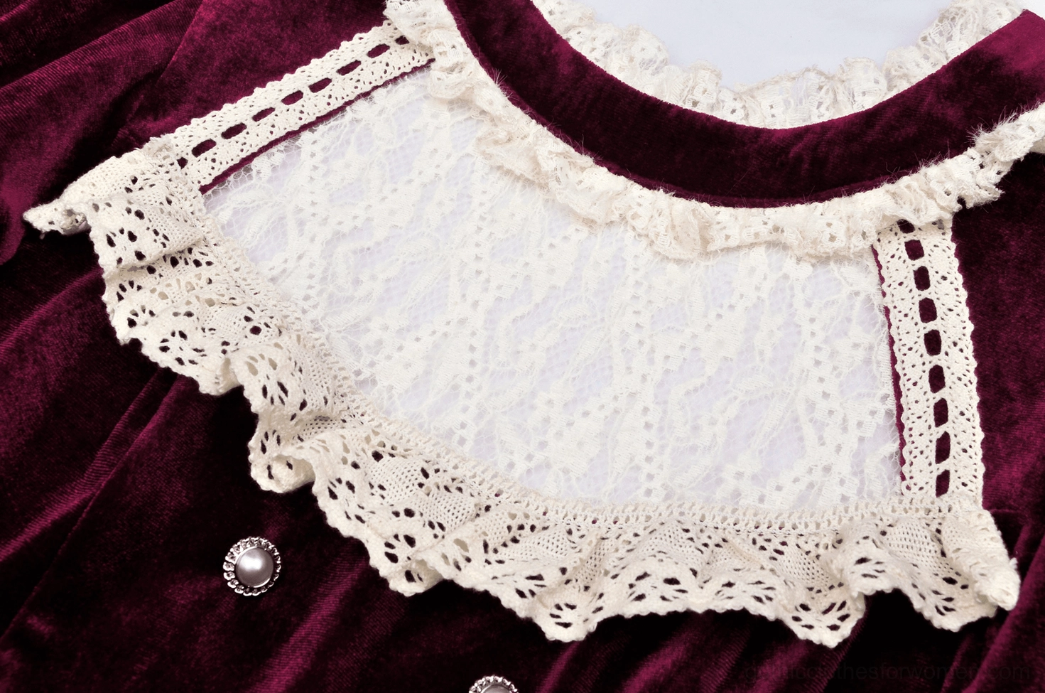 Close-up detail of burgundy gothic dress white lace collar showing ornate ruffled design and velvet contrast