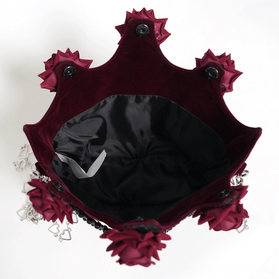 Burgundy gothic rose handbag interior view showing black satin lining and constructed compartments for organization