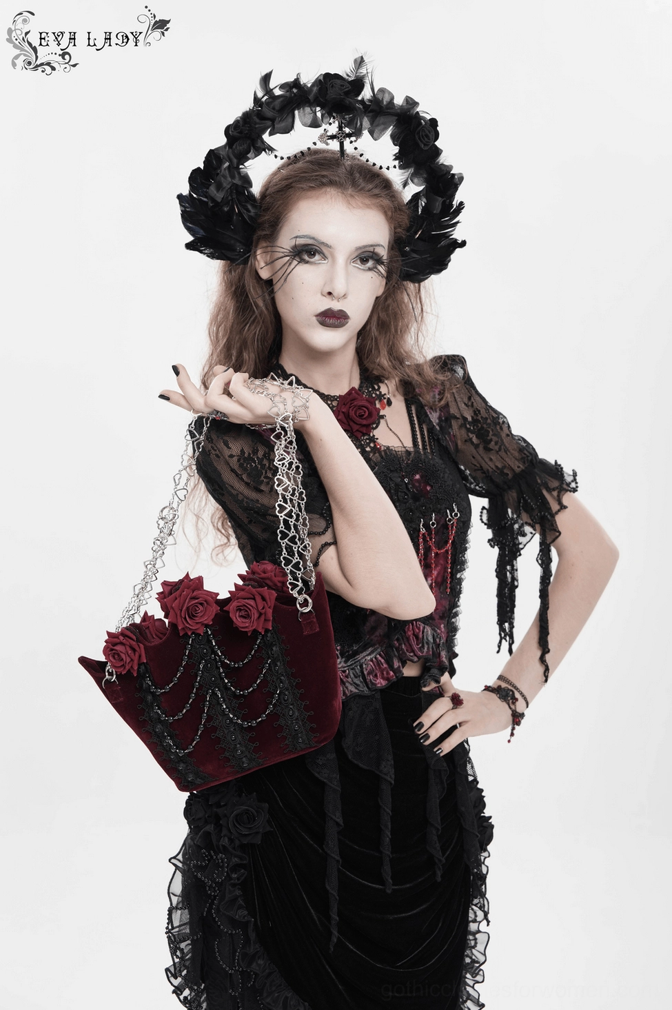 Burgundy gothic rose handbag worn as shoulder bag, demonstrating silhouette, drape, and everyday wearability