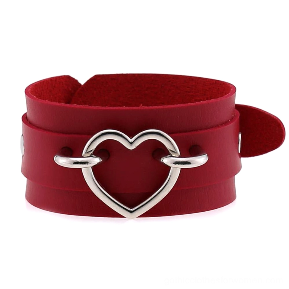 Burgundy red leather heart cuff bracelet with silver hollow heart embellishment, gothic fashion flat lay