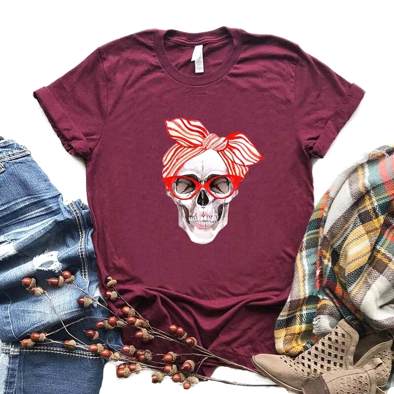 Burgundy gothic skull tee paired with denim, plaid scarf and boots, romantic goth style