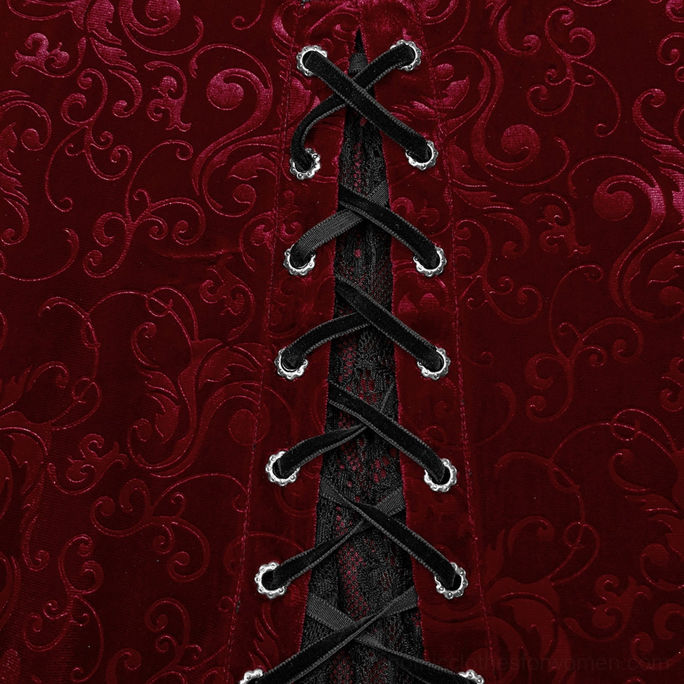 Embossed burgundy velvet fabric close-up - scroll pattern detail with ribbon lacing and metal eyelets