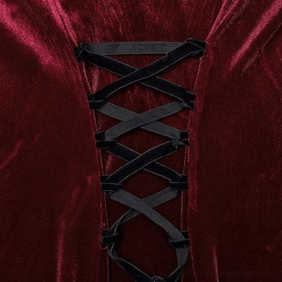 Close-up texture detail of shiny burgundy wine-red velvet fabric on gothic dress showing soft twisted pile