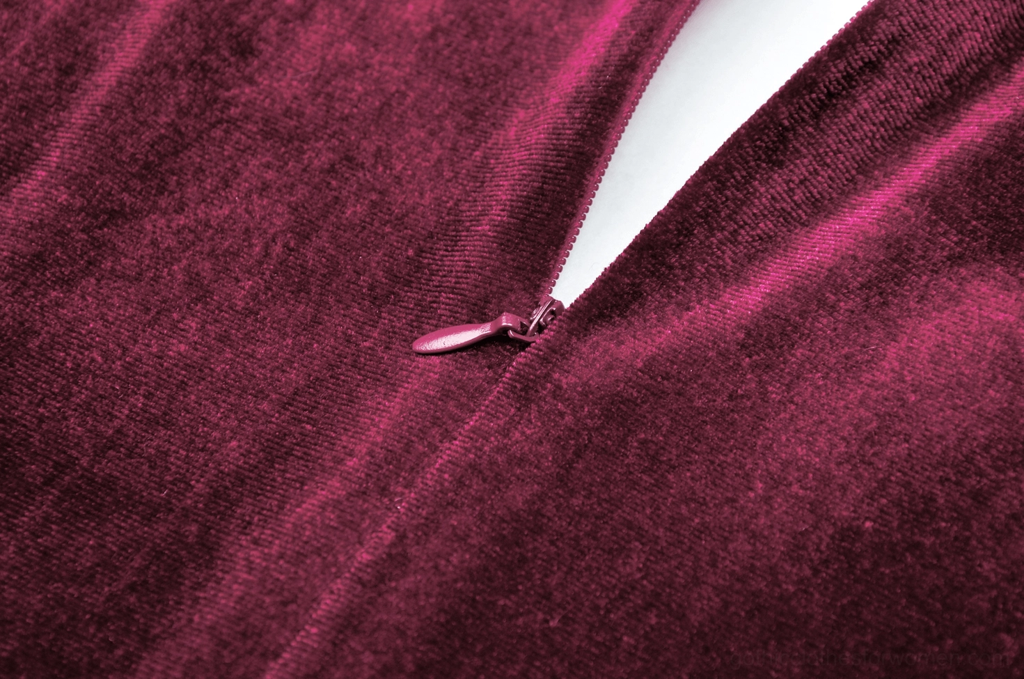 Flat lay back view of burgundy gothic velvet dress showing A-line skirt structure and lace neckline trim