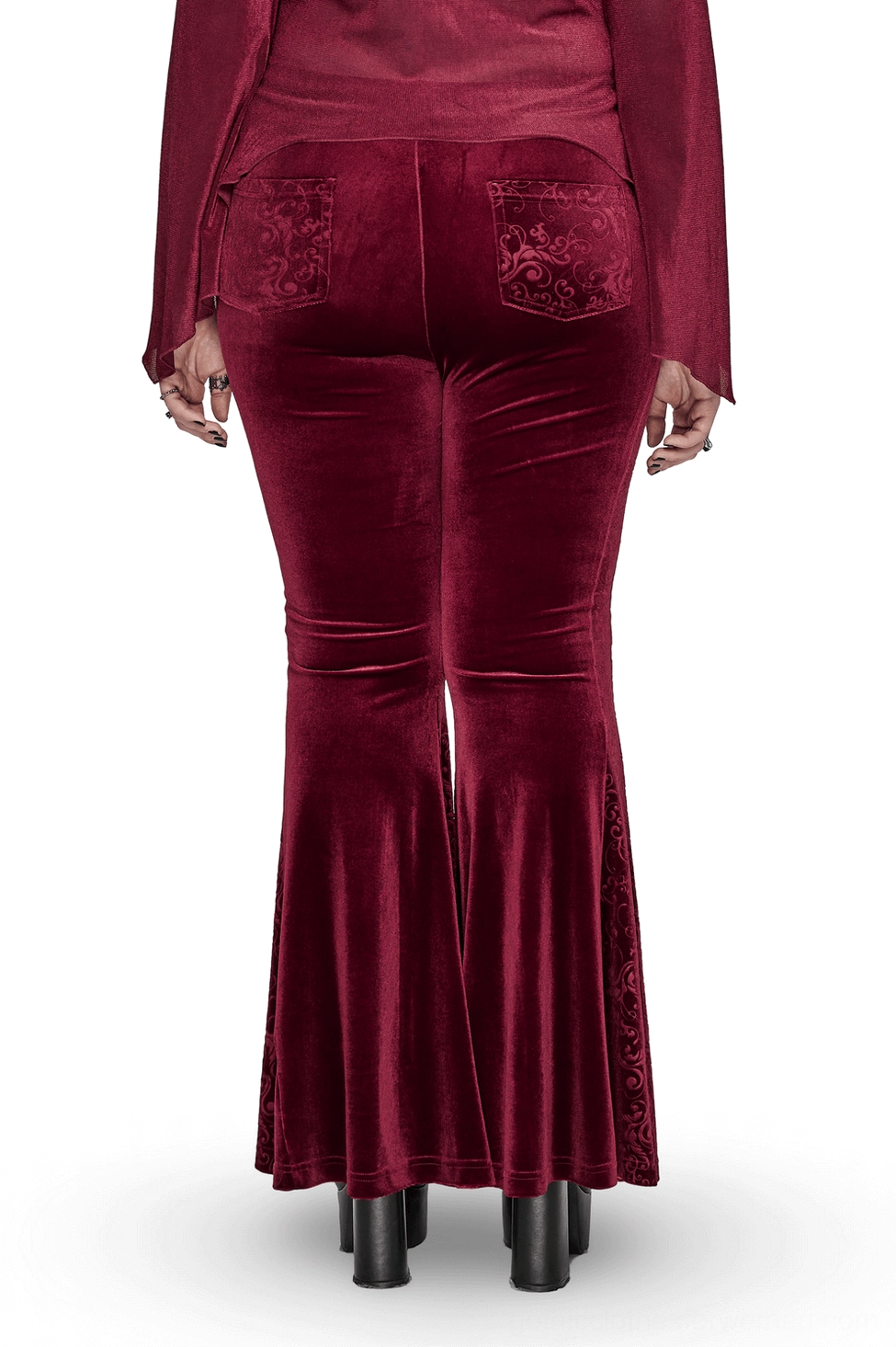 Burgundy velvet gothic flared pants back view displaying embossed pockets and dramatic flared hem