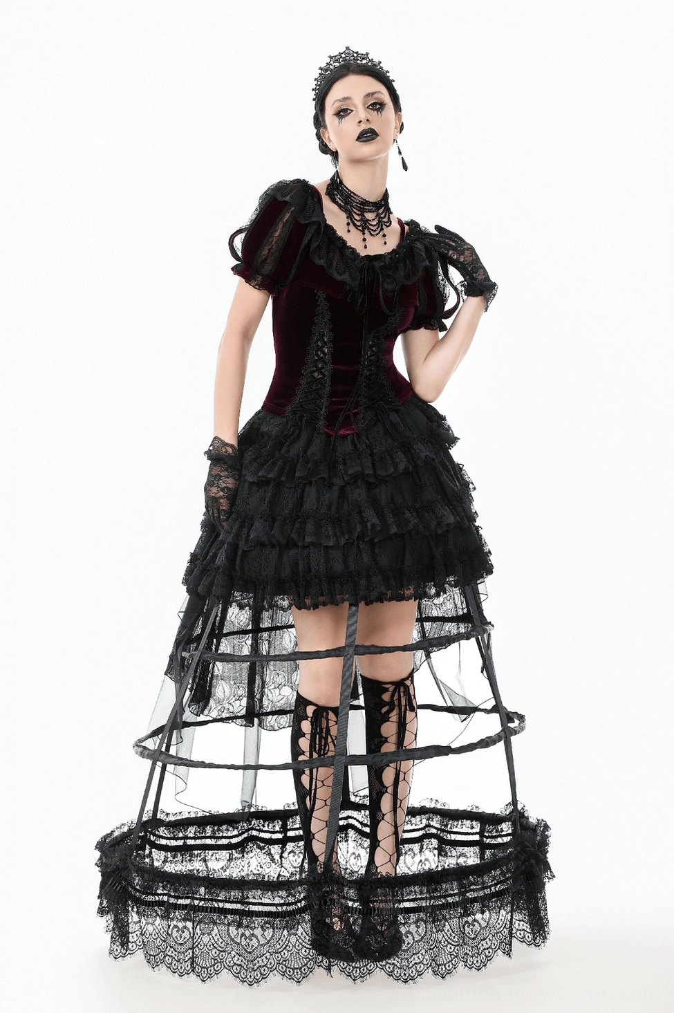 Burgundy Victorian bolero with black lace and ribbon tie details in studio setting