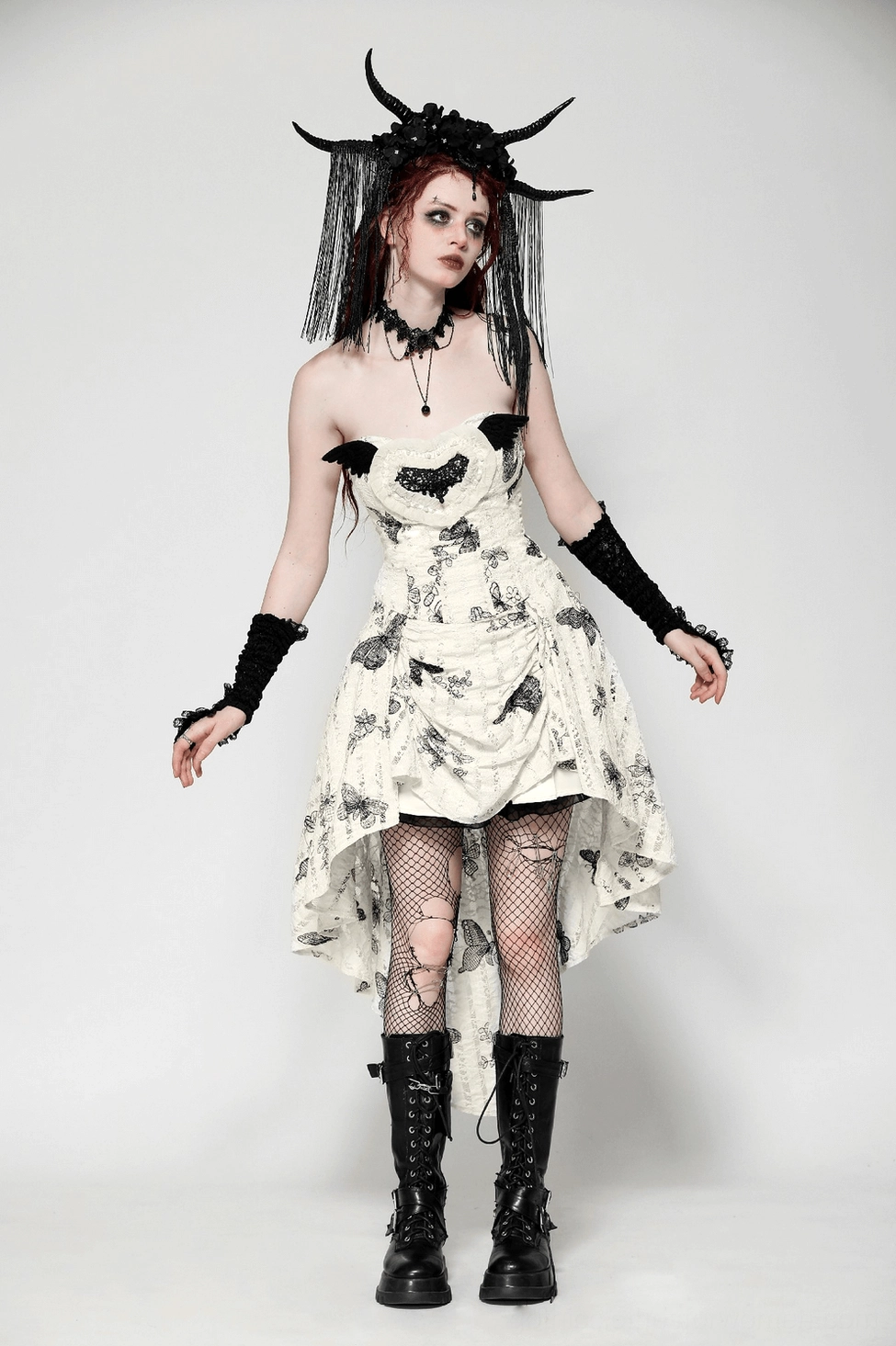 Detail view of gothic butterfly dress fabric texture showing polyester-nylon blend, butterfly print patterns, and construction quality