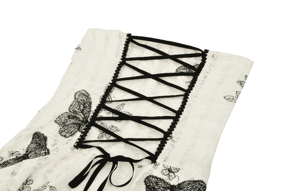 Close-up of gothic butterfly dress corset lace-up back closure with black lace-up straps and decorative ribbon tie