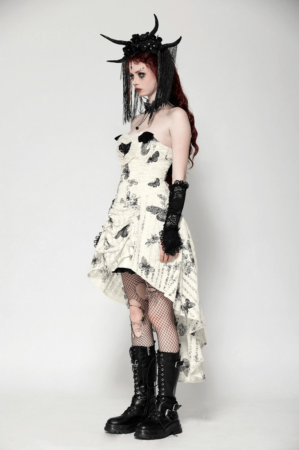 Full-length view of black butterfly off-shoulder gothic dress showing silhouette, hem length, and overall proportions on model