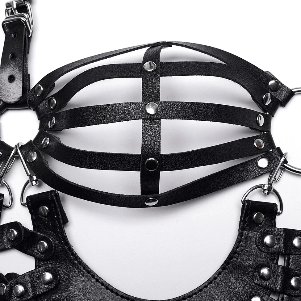 Cage bra strapping assembly top view showing crossed leather straps with metal stud fasteners and hardware connections