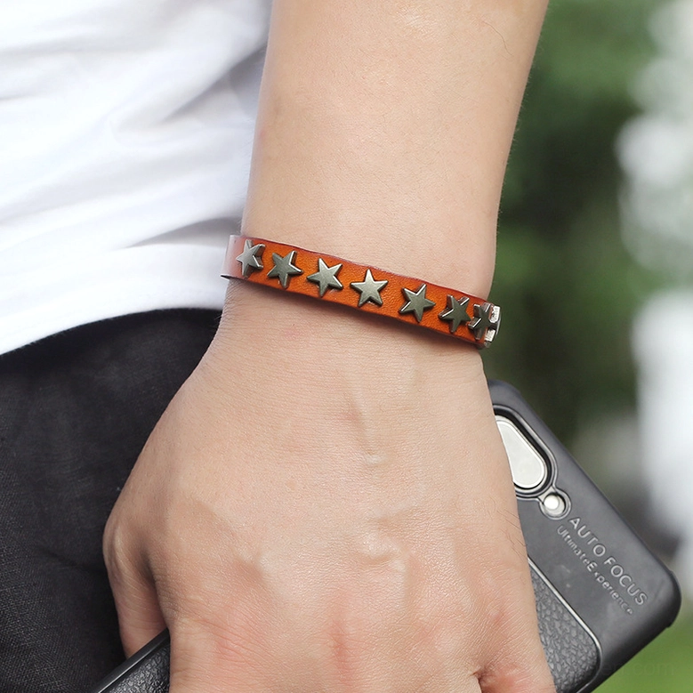 Camel gothic star leather bracelet worn on wrist in outdoor casual setting showing real-world styling