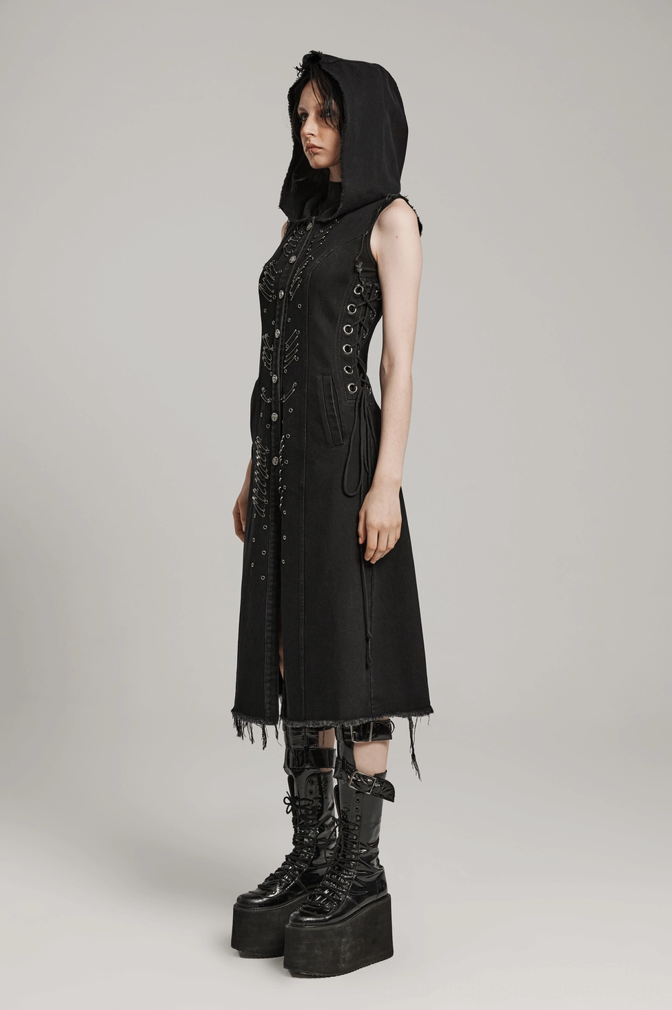 Black denim hooded cape detail focus, safety pin placement, garment construction and finishing