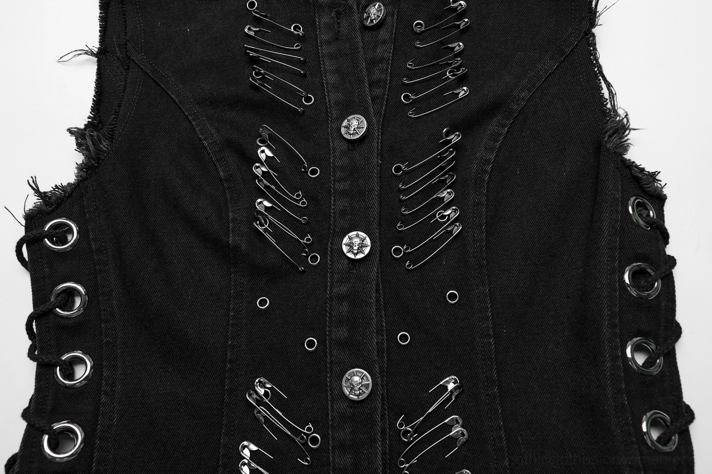 Closeup of denim gothic cape front details, metal safety pin accents, round metal front buttons and side grommet holes