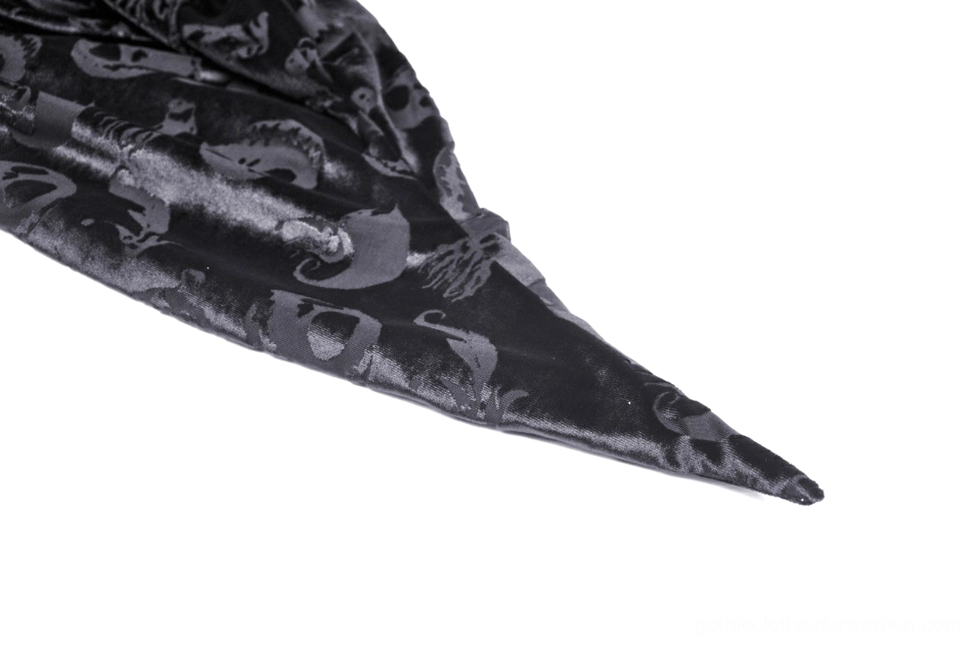 Gothic cape hem close-up, irregular pointed design, moon and skull embossed print, premium velvet fabric detail