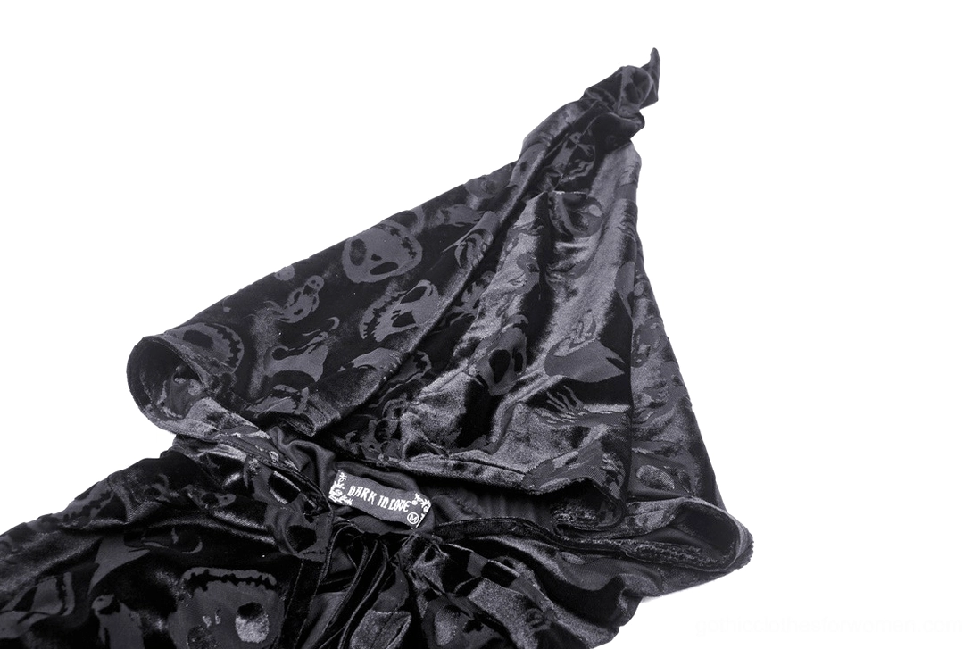 Close-up detail of gothic cape hood, skull embossed velvet texture, fabric quality, and attached hood construction