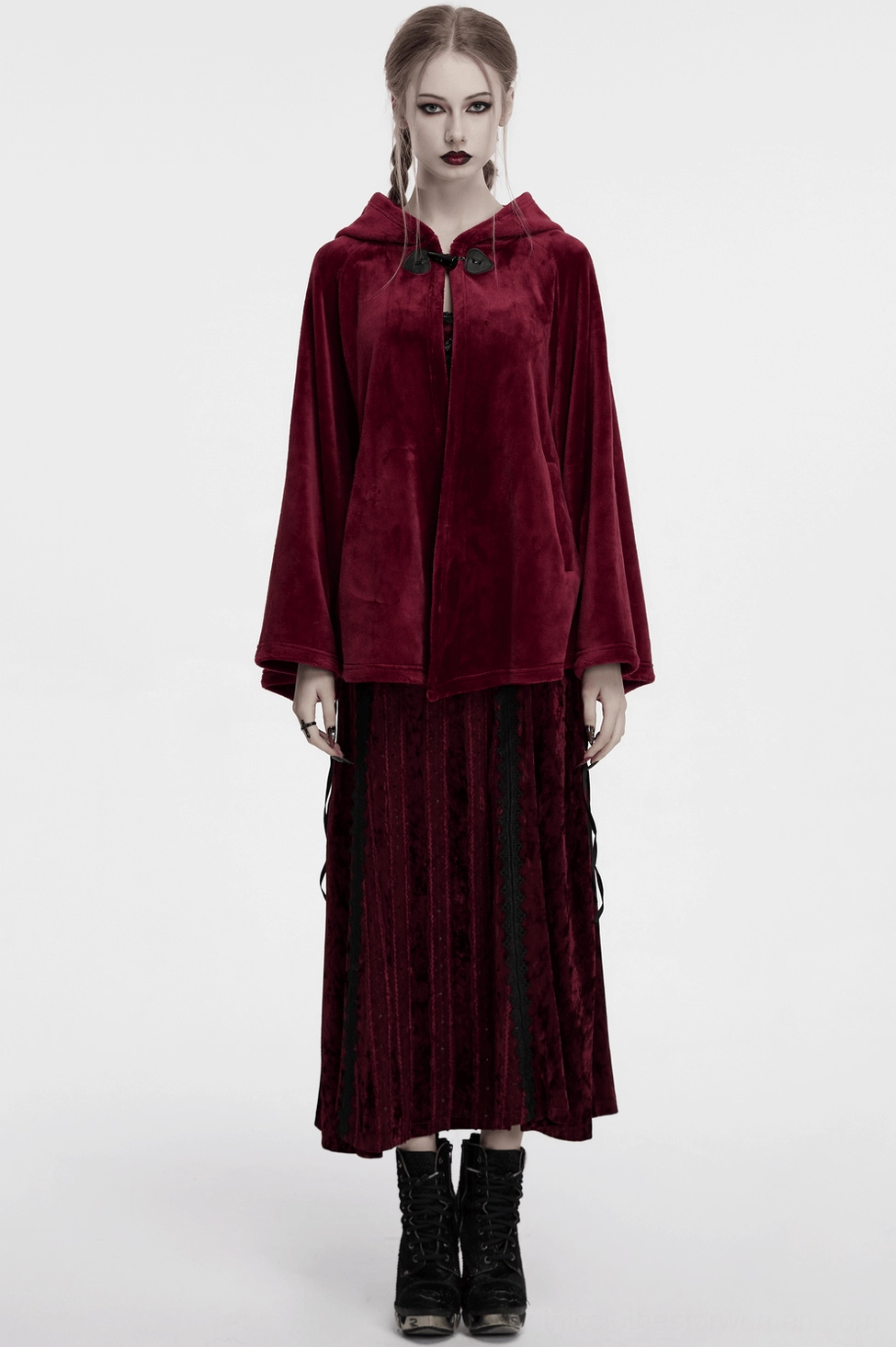 Wine red velvet cape hood detail with black faux fur trim and crescent embroidery visibility