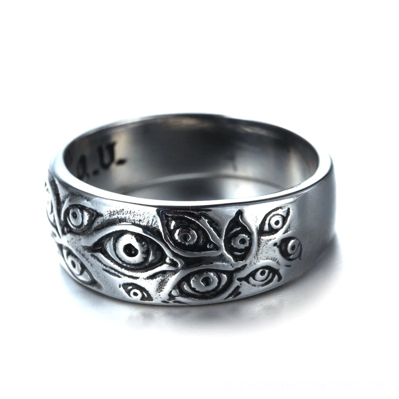 Vintage punk carved eyes ring front-facing full view displaying multiple engraved eye motifs across polished silver metal band with inner A.U stamp