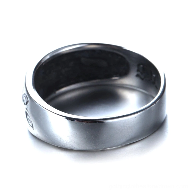 Top-down side view of carved eyes gothic ring showing partial eye motifs and smooth polished inner band surface in silver tone