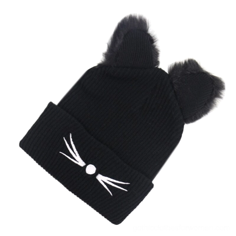 Side view of black cat ear beanie showing asymmetric fuzzy ears and ribbed knit texture