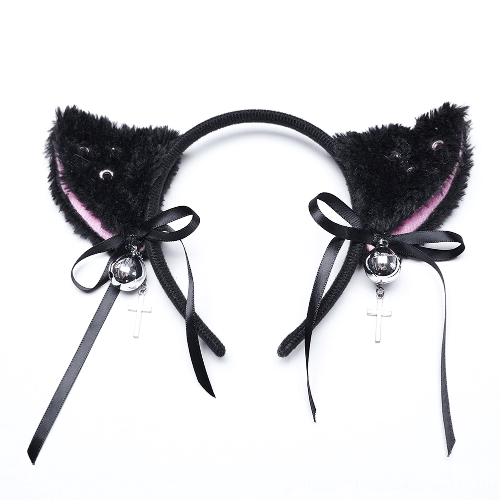 Black faux fur cat ear headband flat lay with pink inner ears, satin bow, silver bell and cross pendant charm