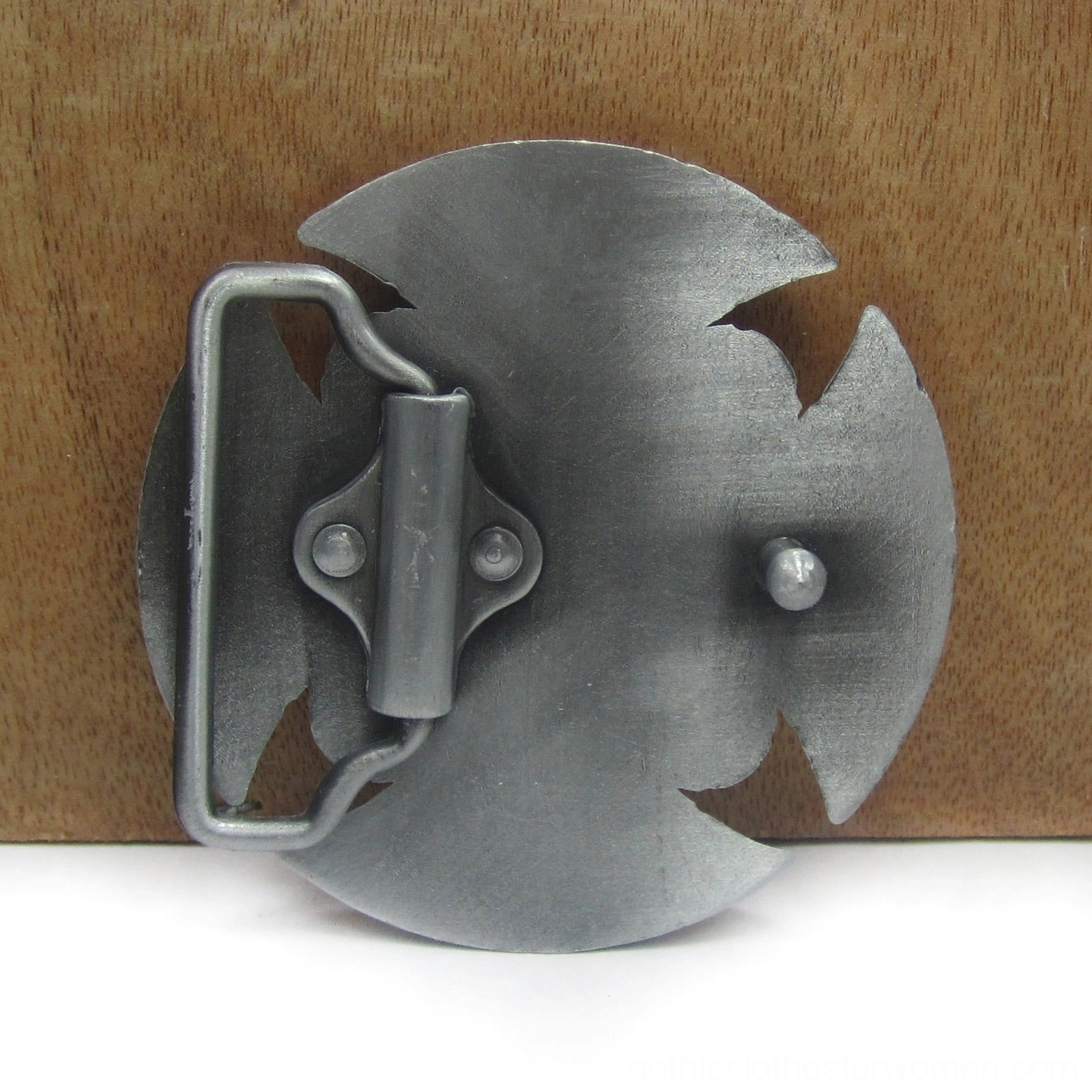 Back of Celtic belt buckle on wood backdrop displaying matte pewter finish and belt mounting system