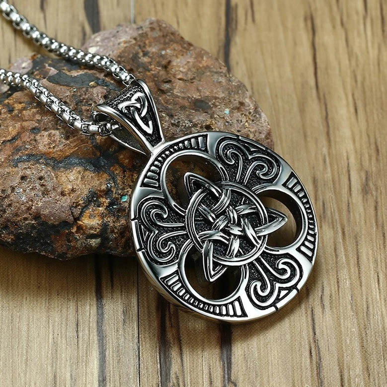 Celtic knot gothic pendant necklace in vintage silver finish, three-quarter view displaying detailed carved circular frame and shield pattern