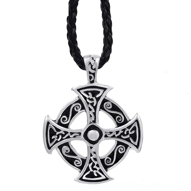 Celtic solar cross pendant necklace with intricate knot-work patterns displayed on black braided leather cord, front flat lay view showcasing silver-toned pewter craftsmanship